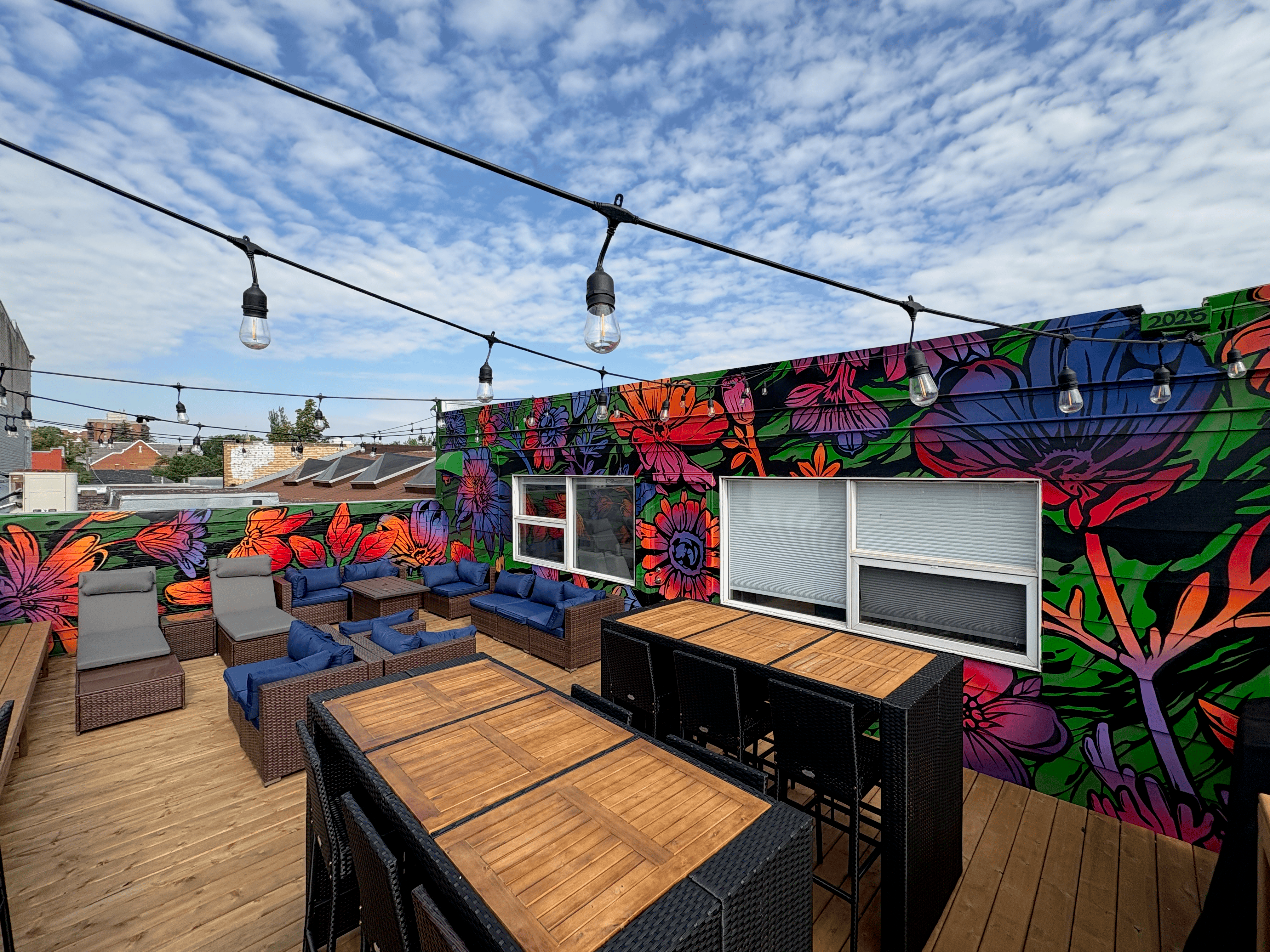 Broadway Collective rooftop mural featuring vibrant floral design